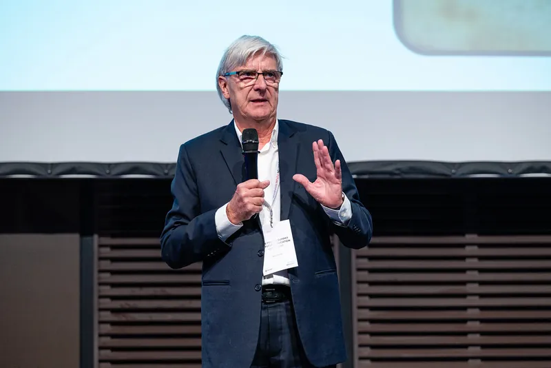 A speaker presenting to the room