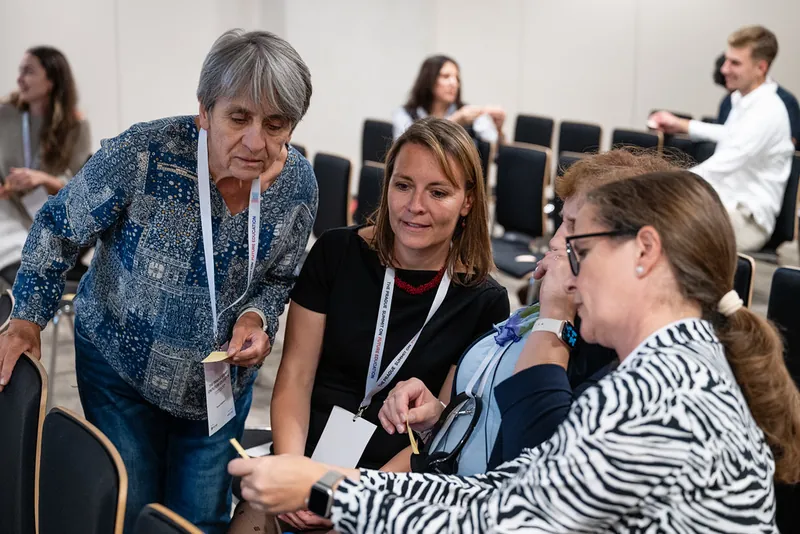 Participants working together in a workshop