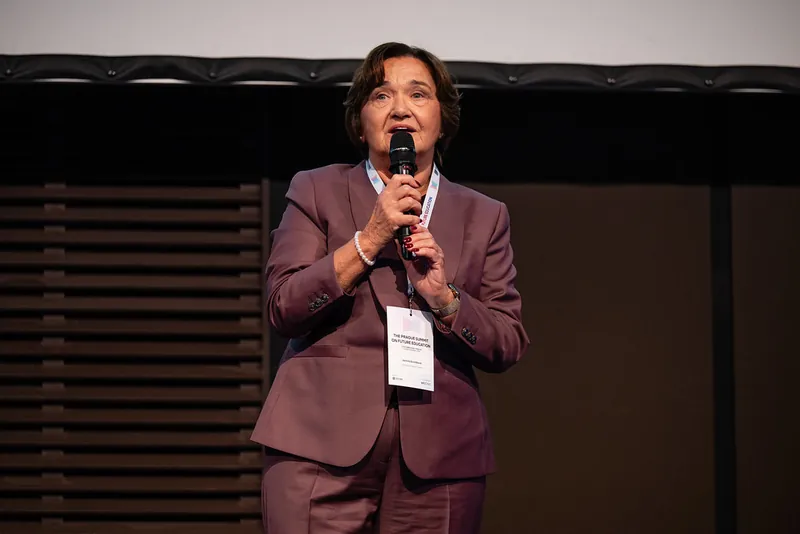 A speaker opening her talk